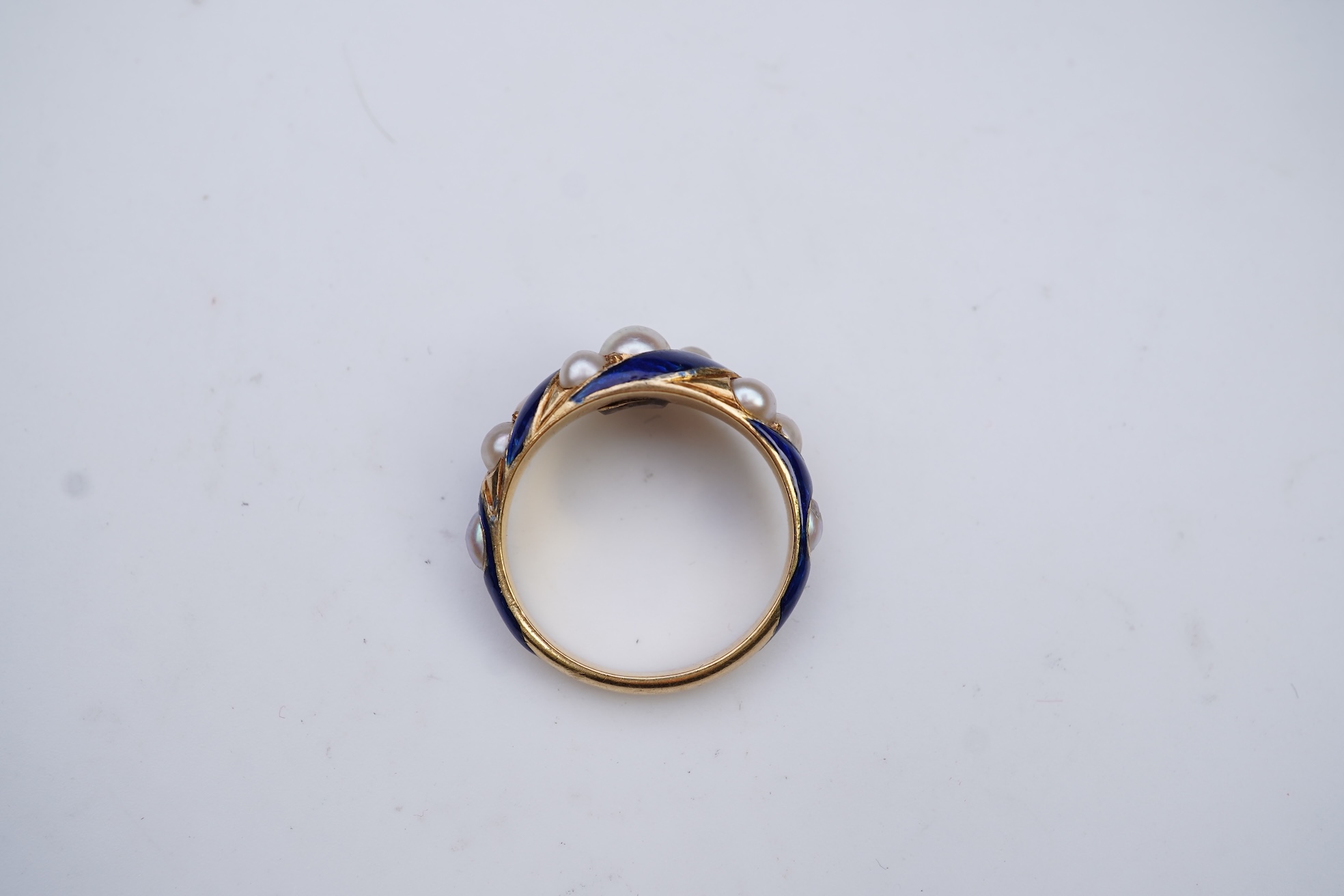 A Victorian half pearl and blue enamel ring, mid 19th century